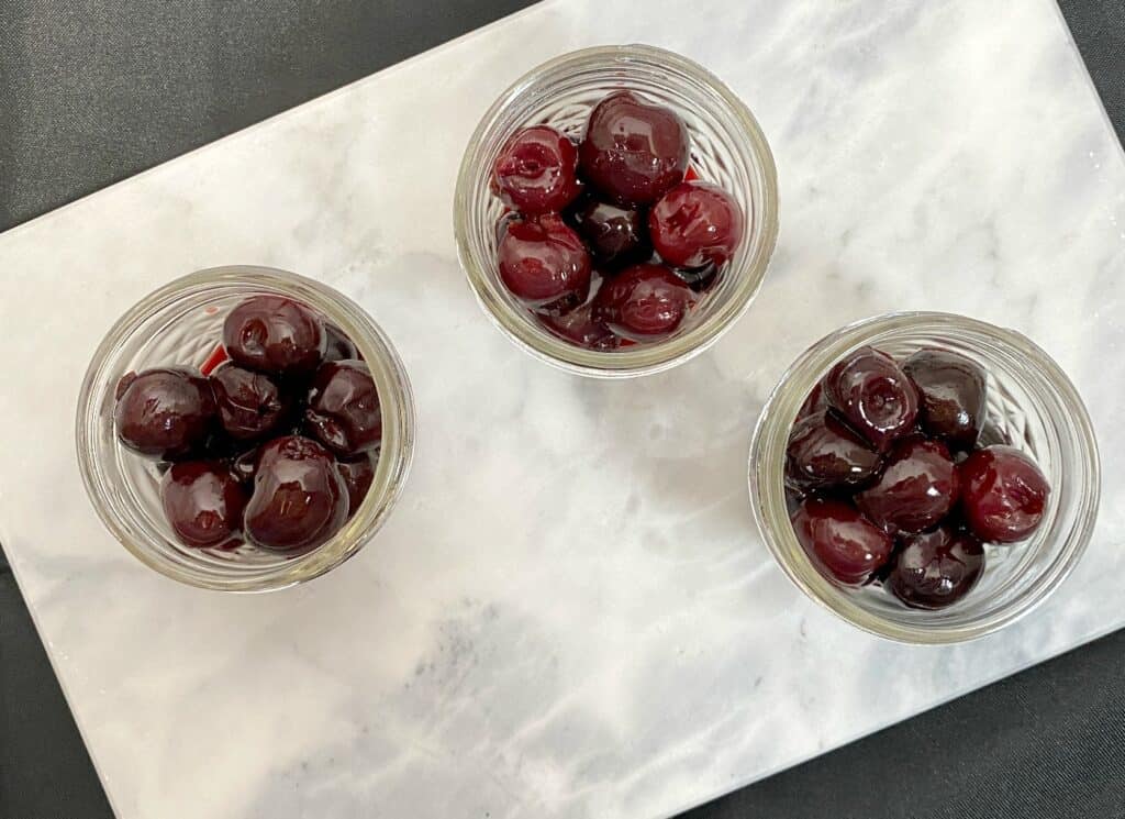 cherries in mason jars for cocktail drinks