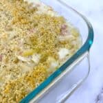 chicken cordon bleu macaroni and cheese in glass casserole dish