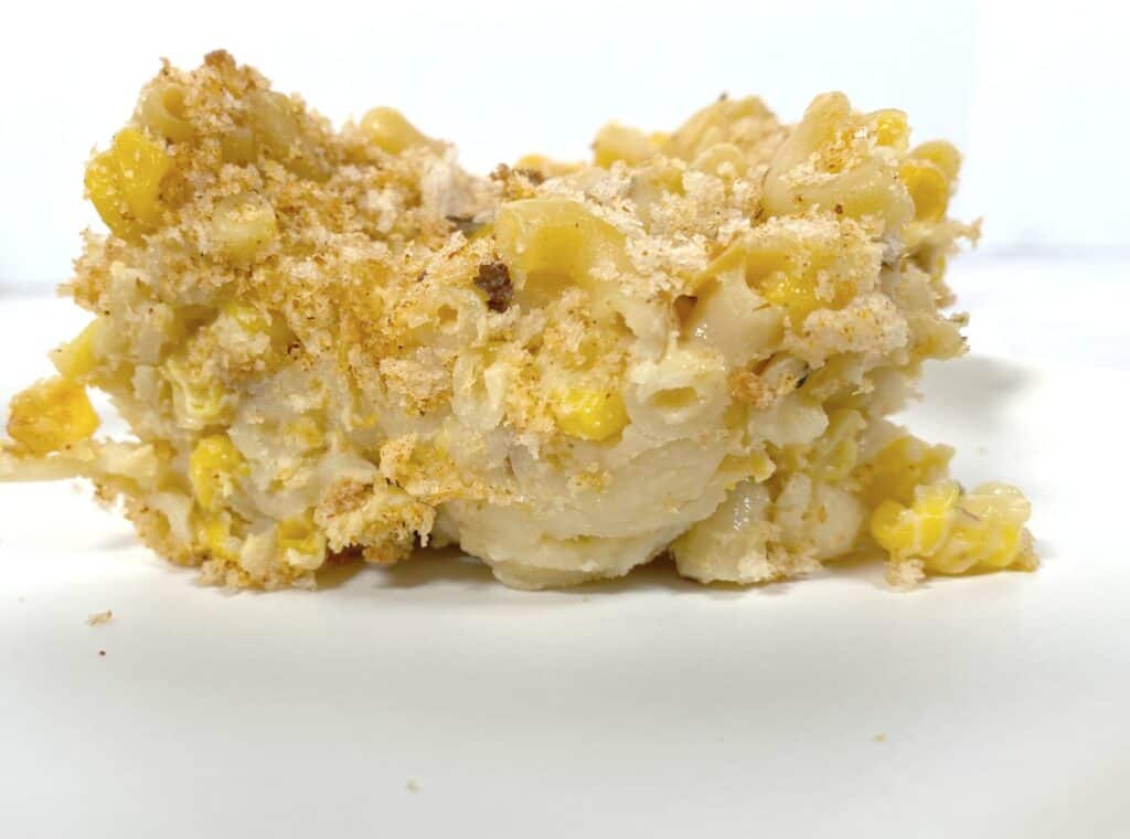 side view picture of corn macaroni and cheese to see the layers of ingredients 