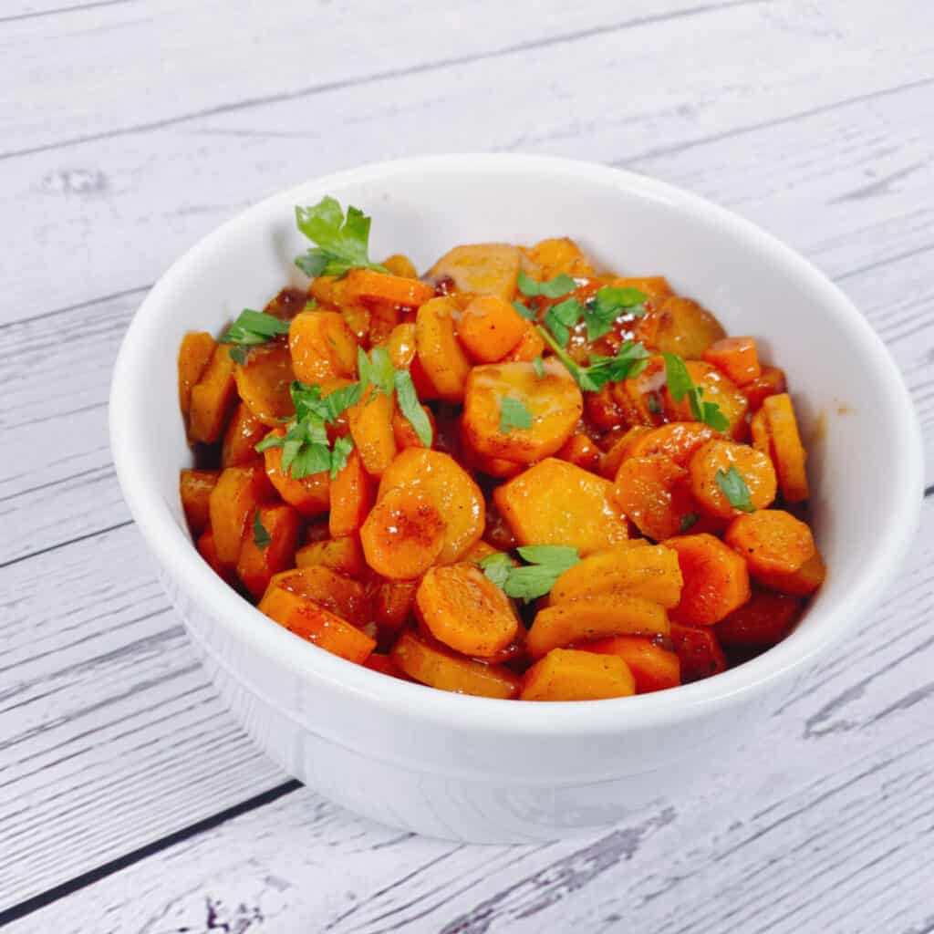 cardamom brown sugar carrots in a white bowl