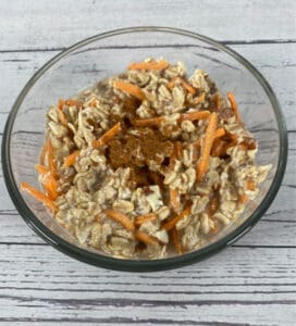 carrot cake overnight oats in a glass bowl