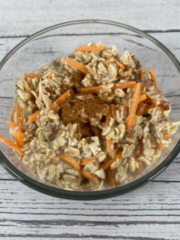 carrot cake overnight oats in a glass bowl