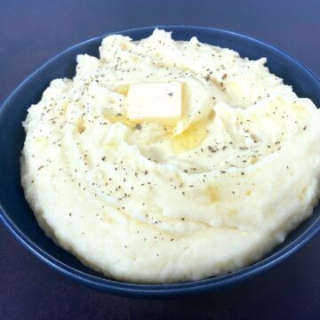 perfect creamy mashed potatoes with a pat of melting butter on top
