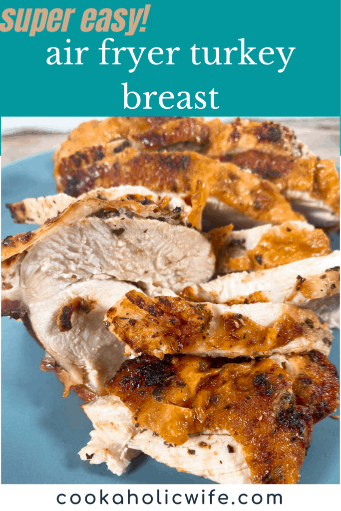 seasoned turkey breast cooked in an air fryer sits, sliced, on a blue plate