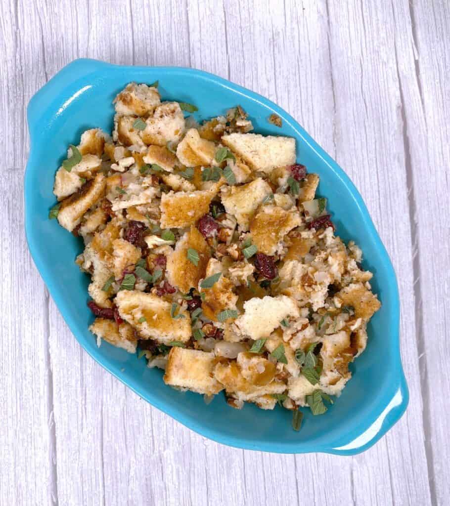 Cranberry pecan stuffing in a teal dish