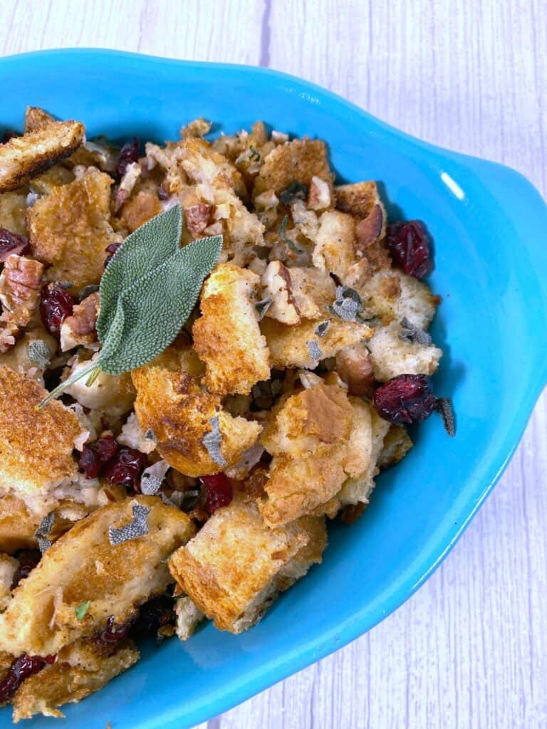 Cranberry pecan stuffing in a teal dish