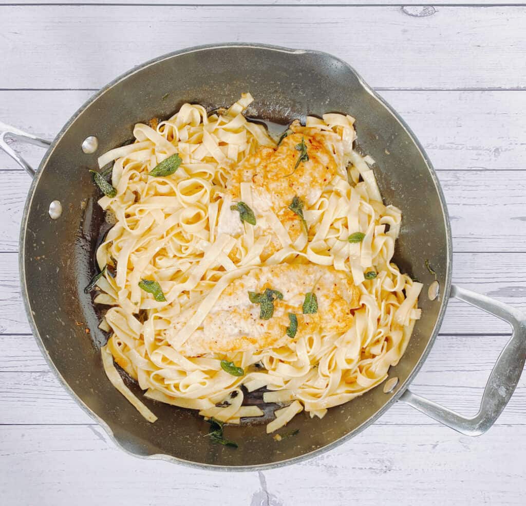 sage butter chicken pasta in a skillet