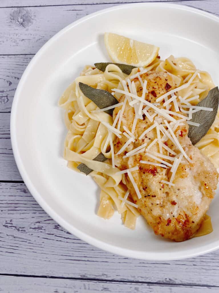 sage butter chicken pasta in a white bowl