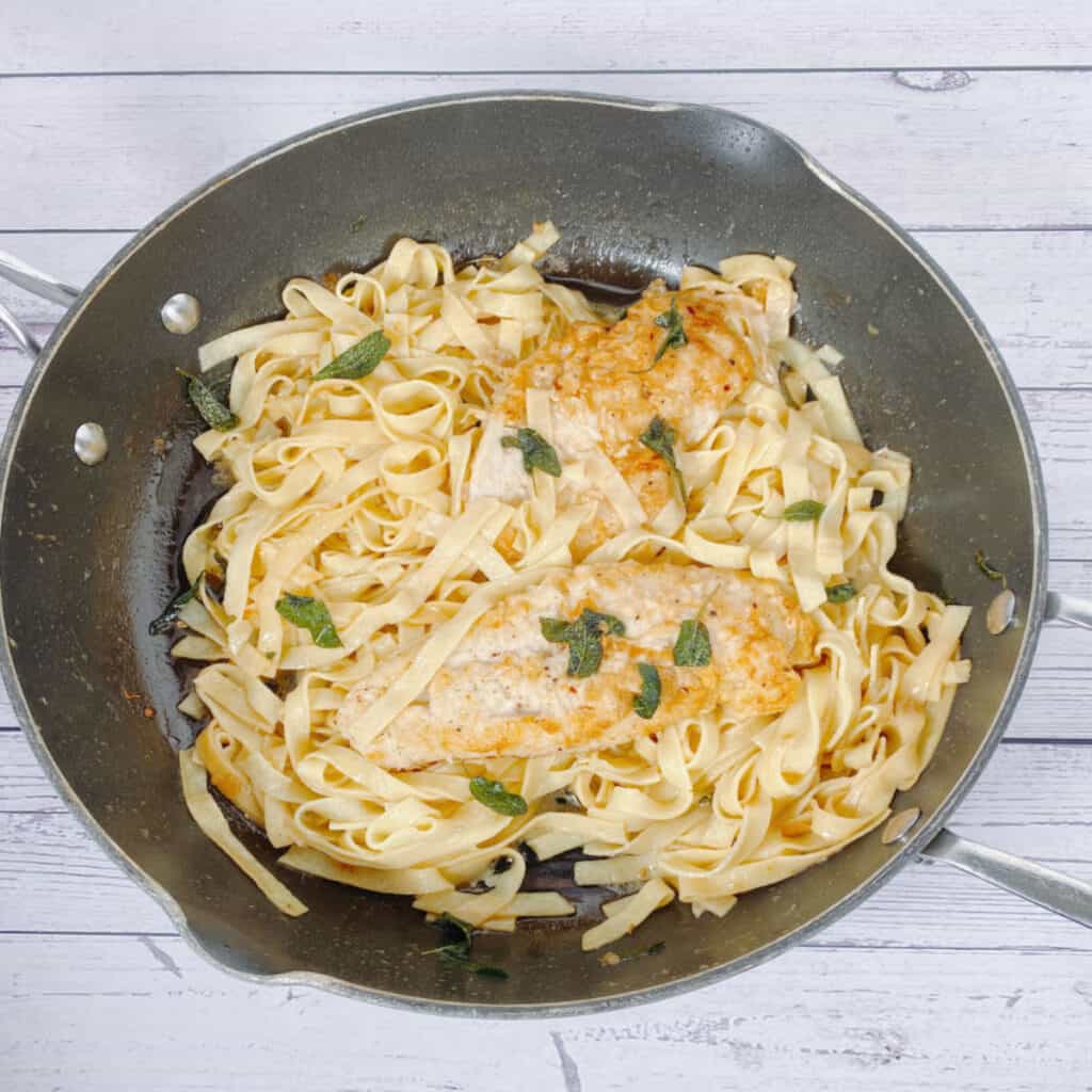 sage butter chicken pasta in a skillet