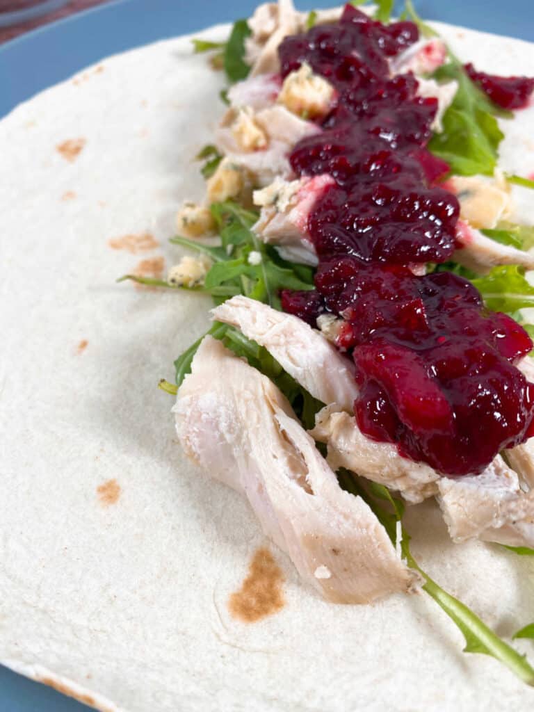 Thanksgiving Turkey Cranberry Wrap – leftover turkey and cranberry sauce are added to a wrap along with blue cheese and arugula