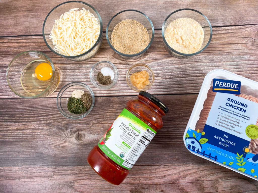 Ingredients for the recipe sit on a wooden background. 