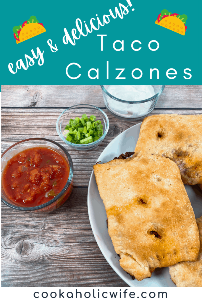 Taco Calzones sit on a white plate on a wooden background. To the left of the calzones are glass bowls with salsa, green onions and sour cream. 
