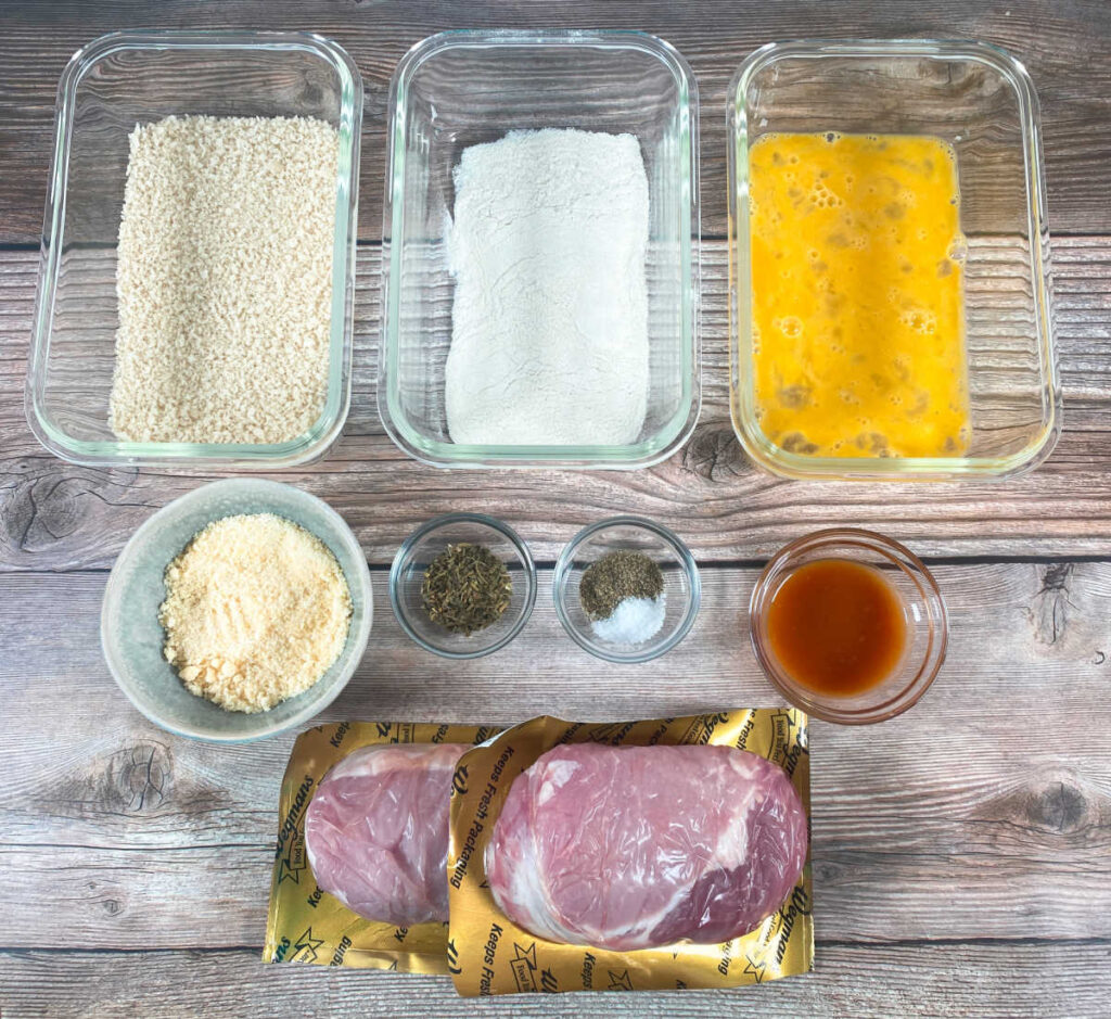 ingredients for this recipe sit in bowls on a wooden background. 