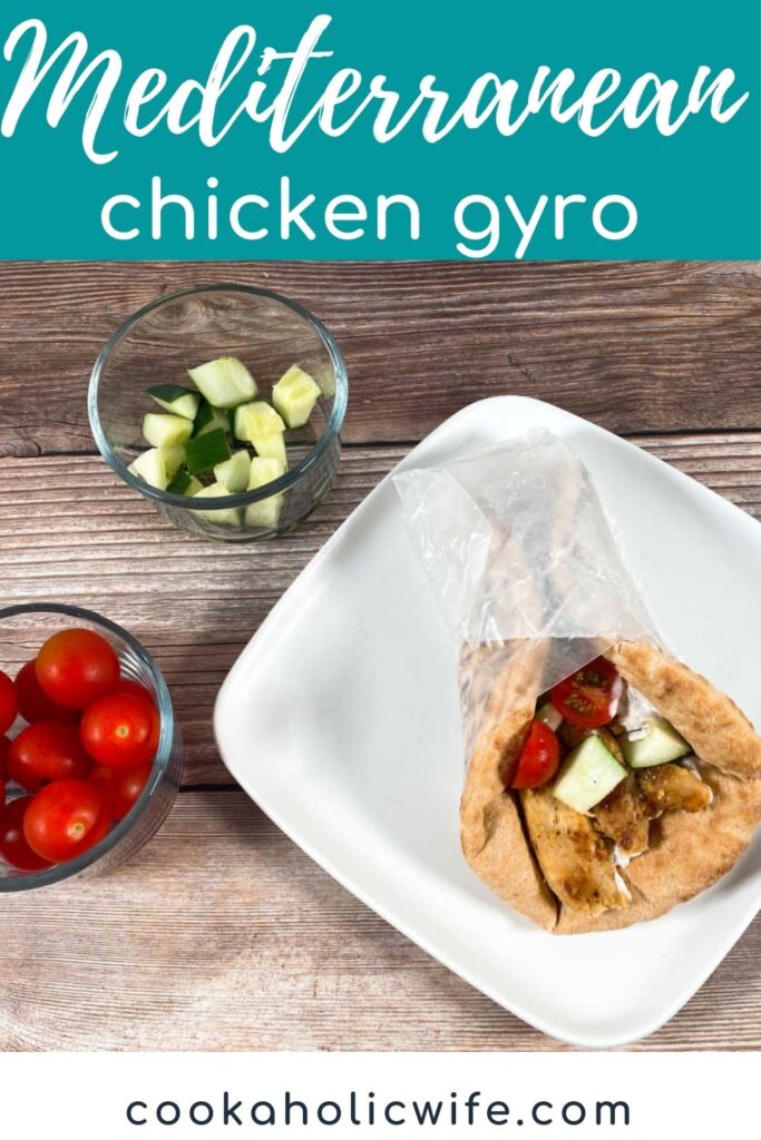 Pinterest version of image with text overlay of recipe title at top. Overhead image of a gyro on a white plate with bowls of cucumber and tomato to the left.