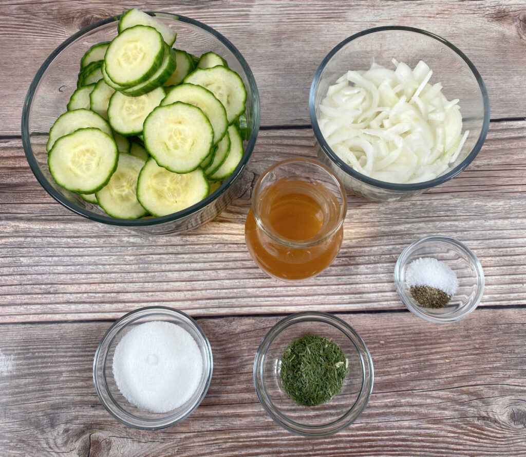 ingredients for the recipe sit on a wooden background. 