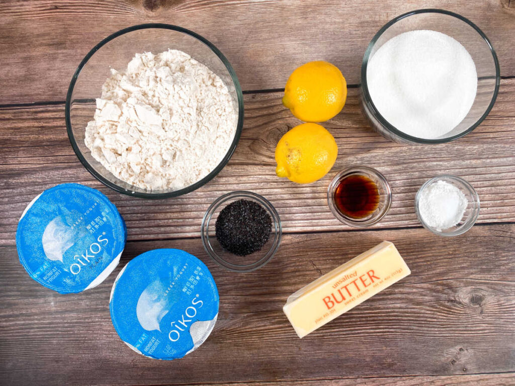 ingredients for the muffins sit on a wooden background