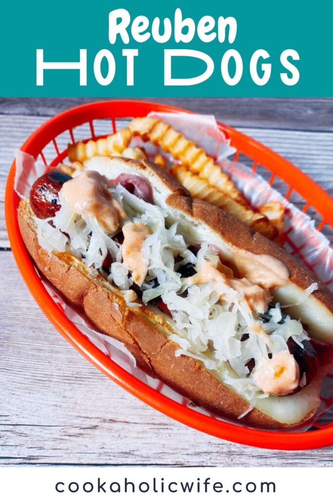 Overhead view of hot dog, topped with sauerkraut and thousand island dressing, sitting in a red tray. 