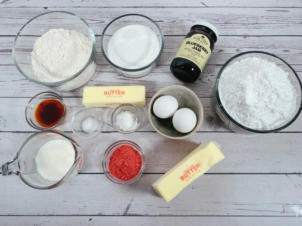 ingredients to make this recipe sit in bowls on a white wooden background,. 