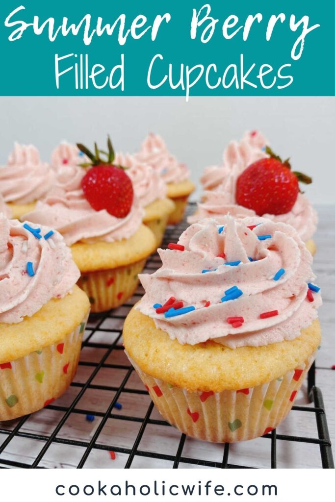 image for Pinterest with text overlay of recipe title at top. Decorated cupcakes sit on a wire cooling rack. 