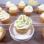 cupcake sits on a white cupcake stand surrounded by the other cupcakes