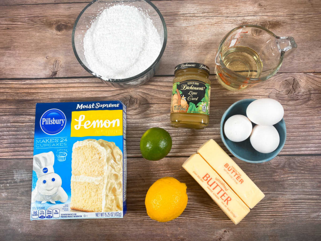 ingredients to make the cupcakes sit on a wooden background 