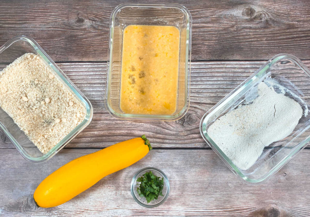 ingredients for the recipe sit on a wooden background 