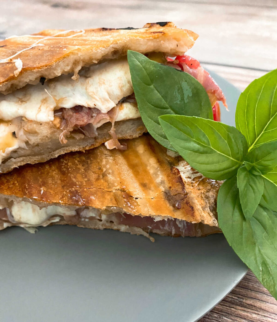 close up image of the panini sliced in half. 