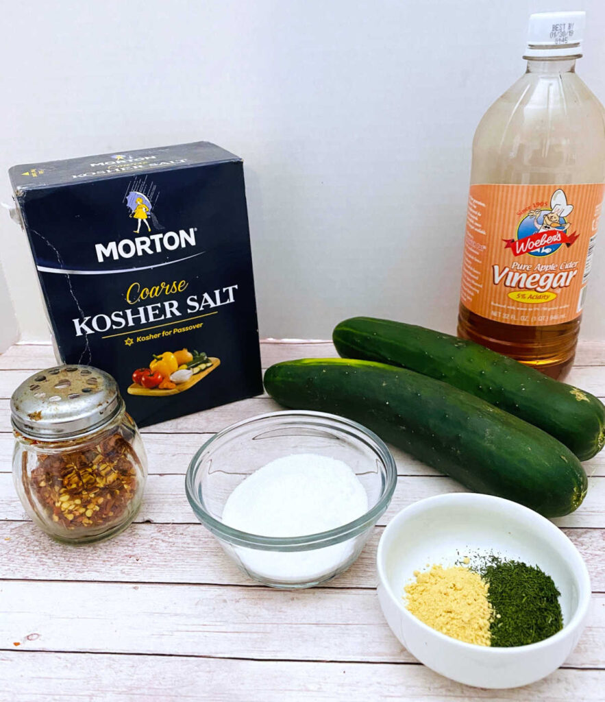 ingredients for the recipe sit on a white wooden background. 