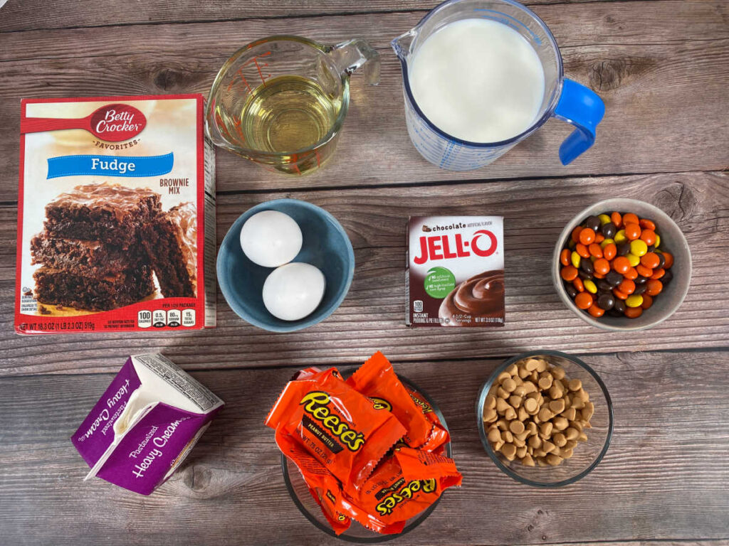 ingredients for the trifles sit in glass bowls on a wooden background. 