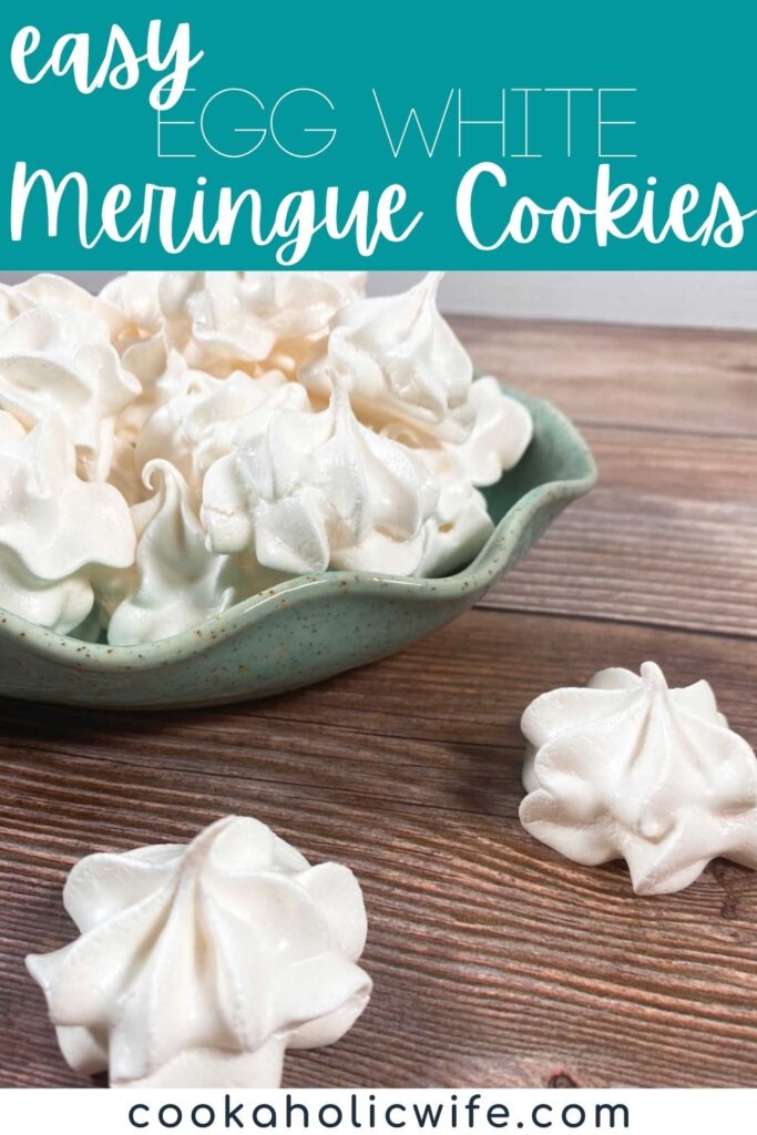 Image for Pinterest, text overlay with recipe title at top. green bowl stacked high with meringue cookies sits on a wooden background. two cookies are in front of the bowl on the background.