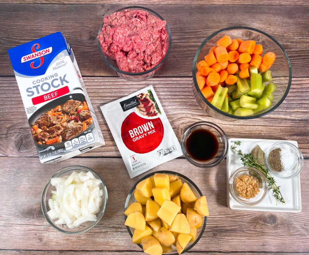 ingredients for the recipe are in glass bowls on a wooden background.