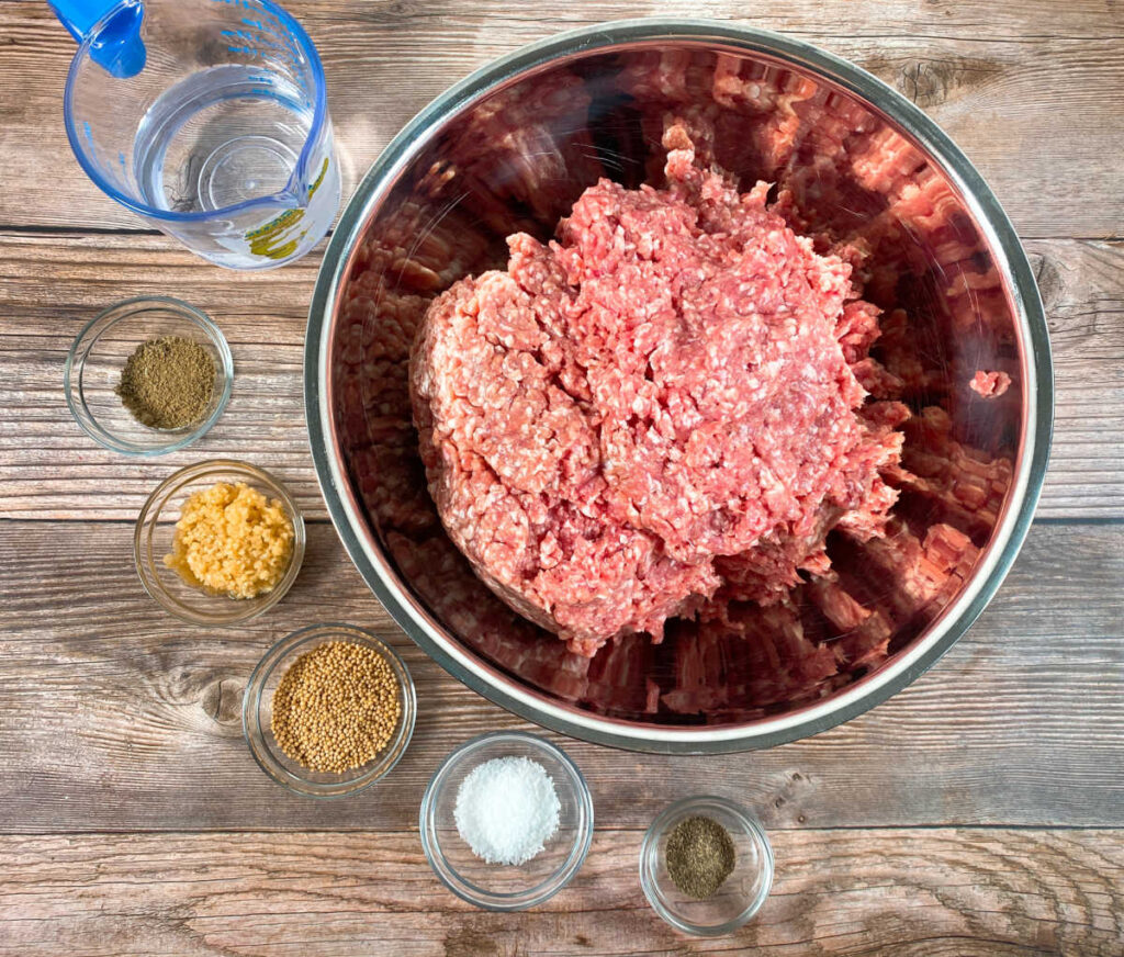 ingredients for the recipe sit on a wooden background 