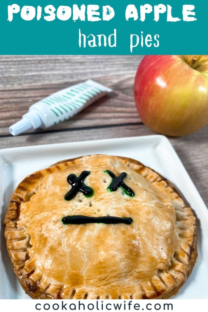 Image for Pinterest with recipe title text overlay. Hand Pie decorated with a Mr. Yuk face sits on a white plate with an apple and food coloring in the background.