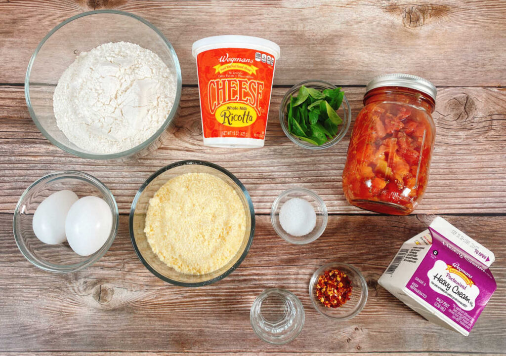 ingredients for the recipe sit on a wooden background 