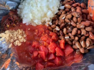 process shot - ingredients for turkey chili are added to a slow cooker. 