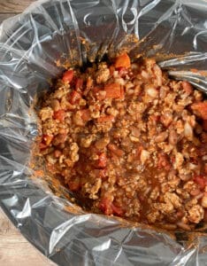 process shot - all ingredients for the chili are mixed together in the slow cooker.