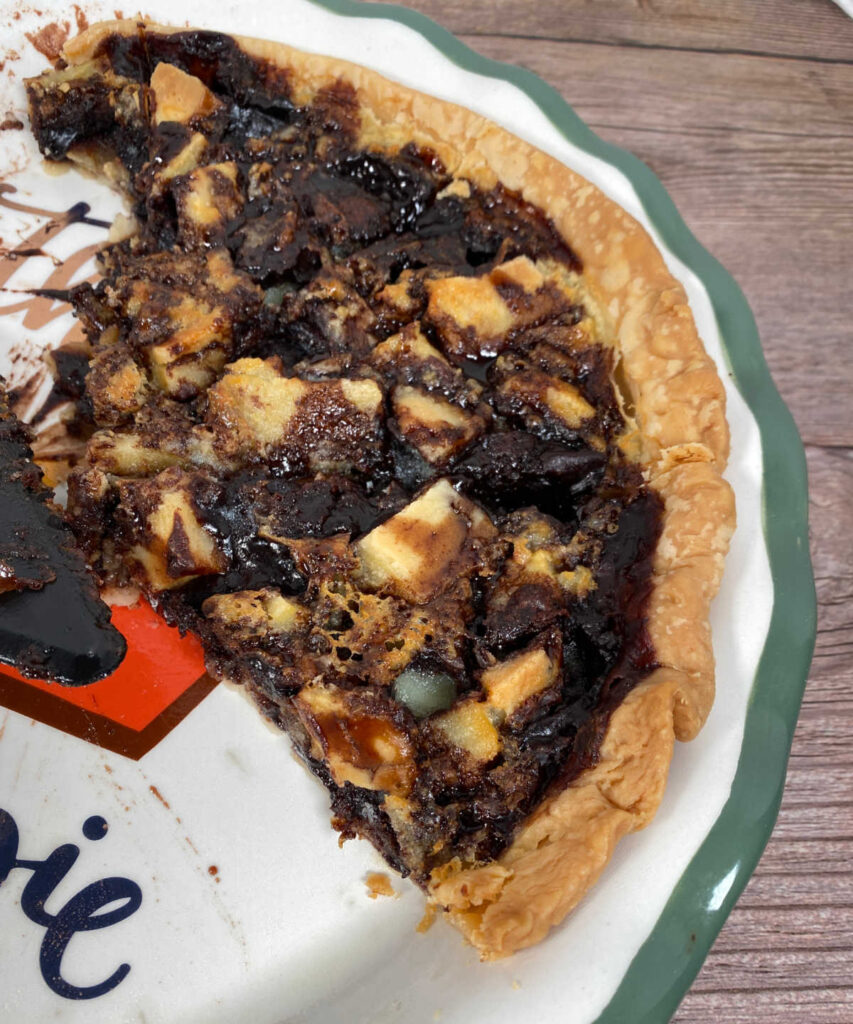 Half empty pie plate shows remaining slices of the pie. 