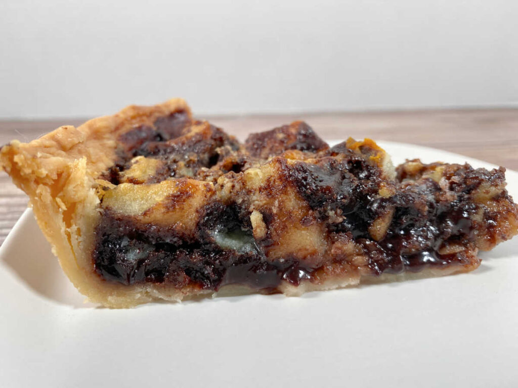 Side view of slice of pie, showing the cookies baked into the pie. 