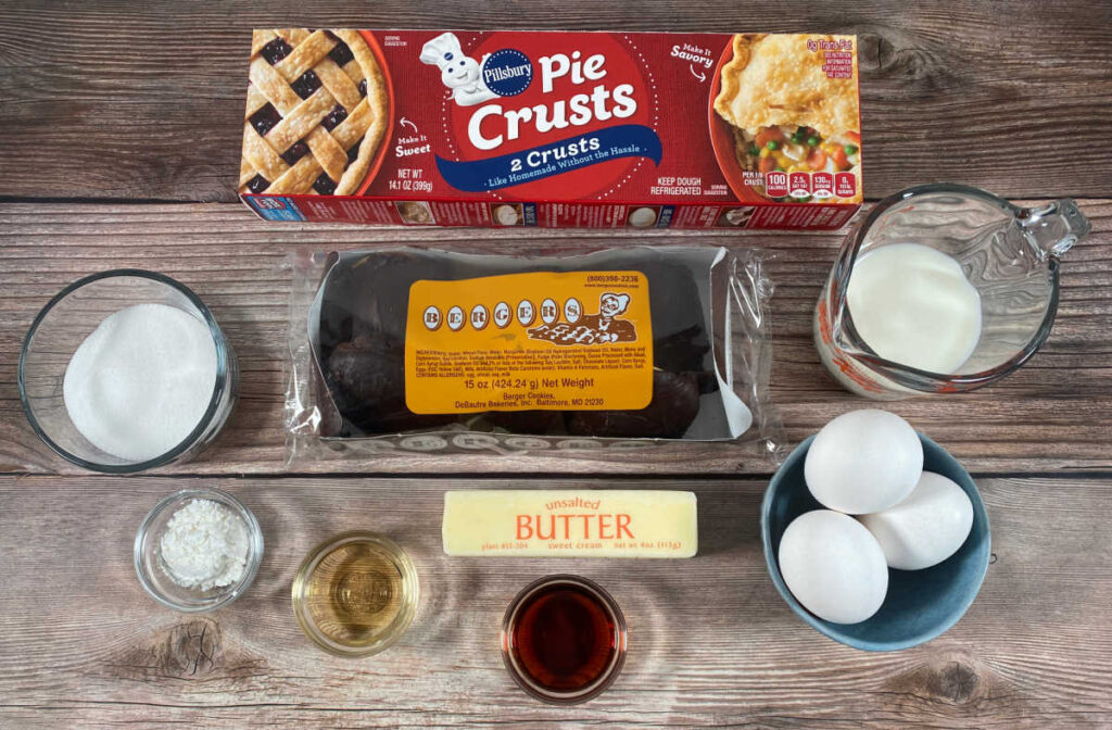 ingredients for the recipe sit on a wooden background. 