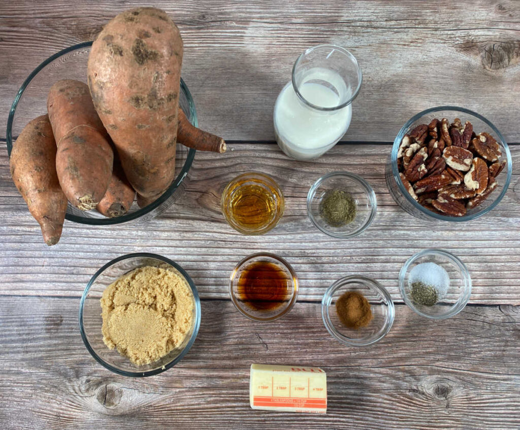 ingredients for the recipe sit in glass bowls on a wooden table. 