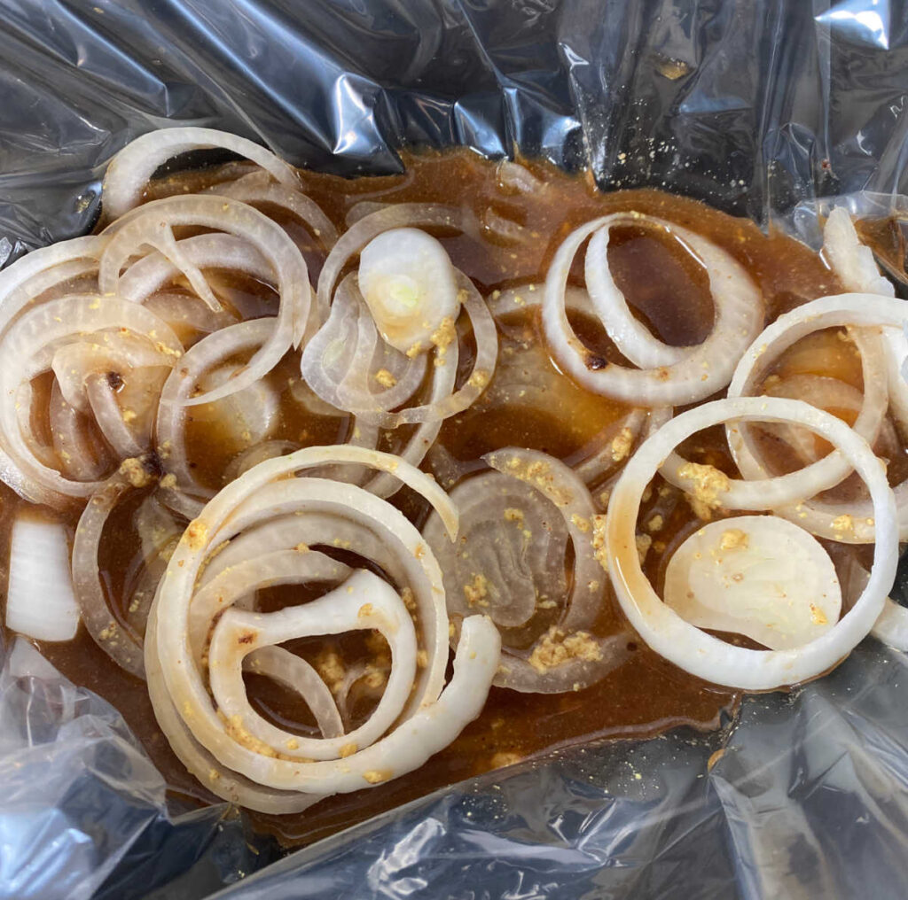 Process shot - liquids and onions are in the slow cooker. 