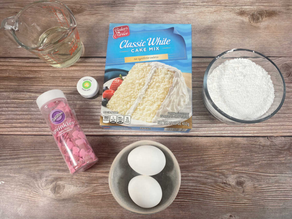 ingredients for the recipe sit on a wooden background. 