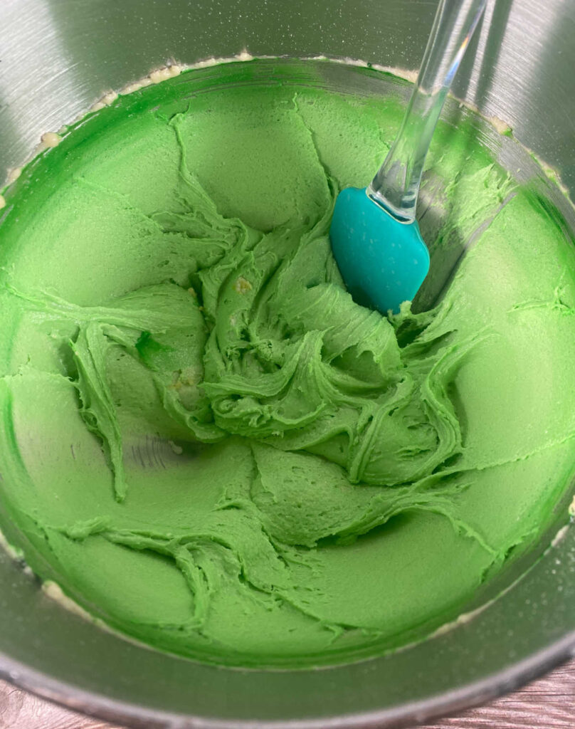 Process shot  - batter is tinted green from the food coloring. 