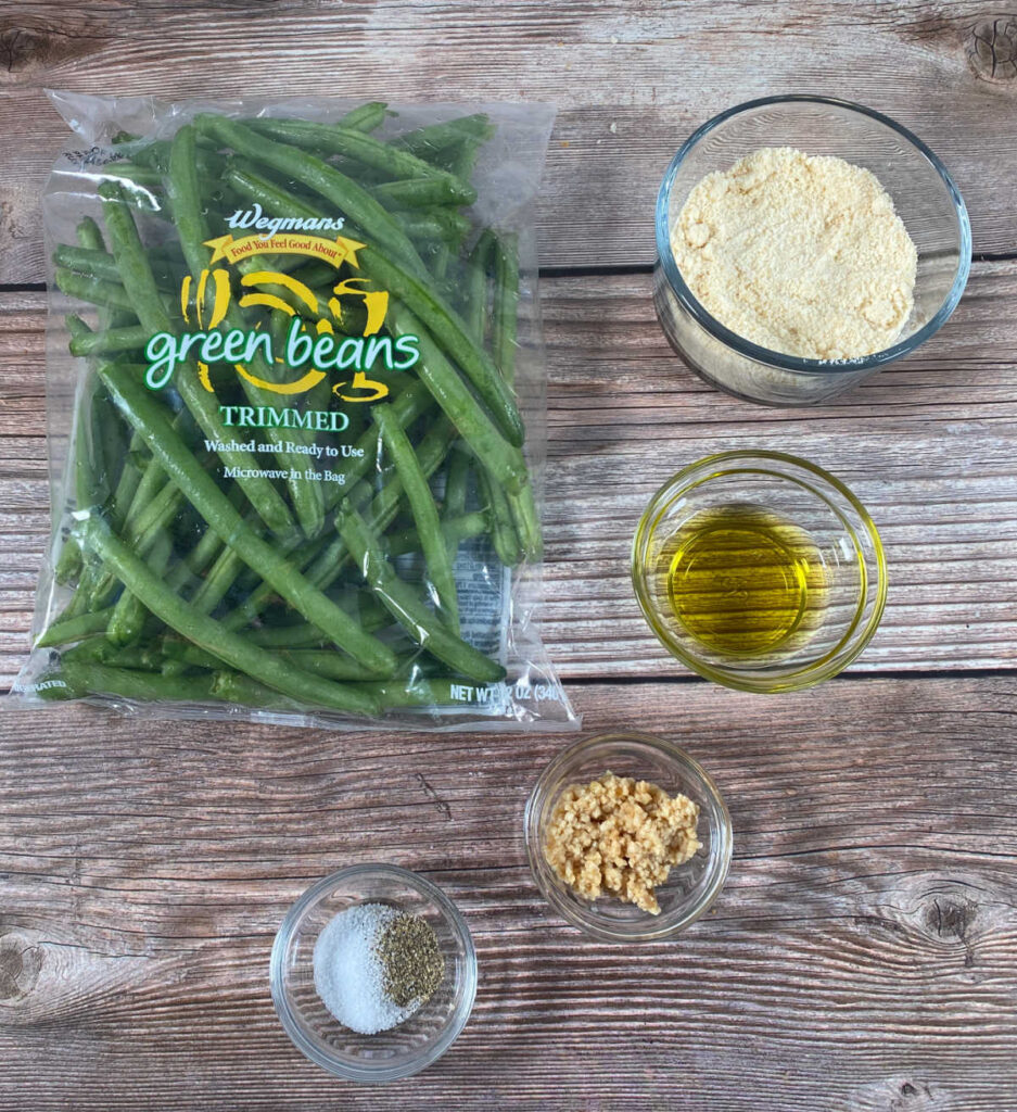 ingredients for the recipe sit on a wooden background. 