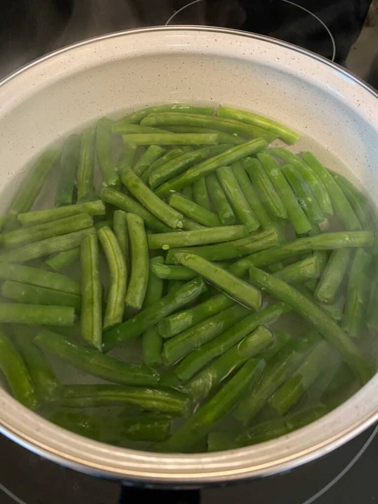 process shot - green beans in a pot of boiling water 