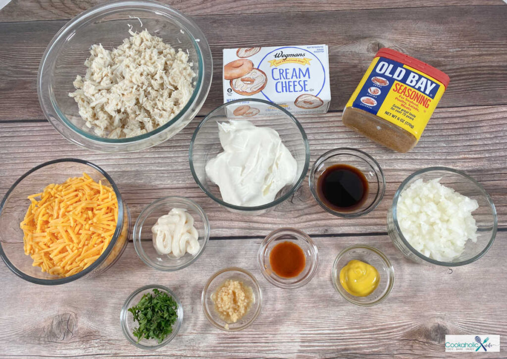 ingredients for the recipe sit in glass bowls on a wooden background. 