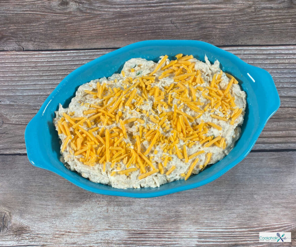 Process Shot - crab dip is in the baking dish topped with the remaining shredded cheese. 