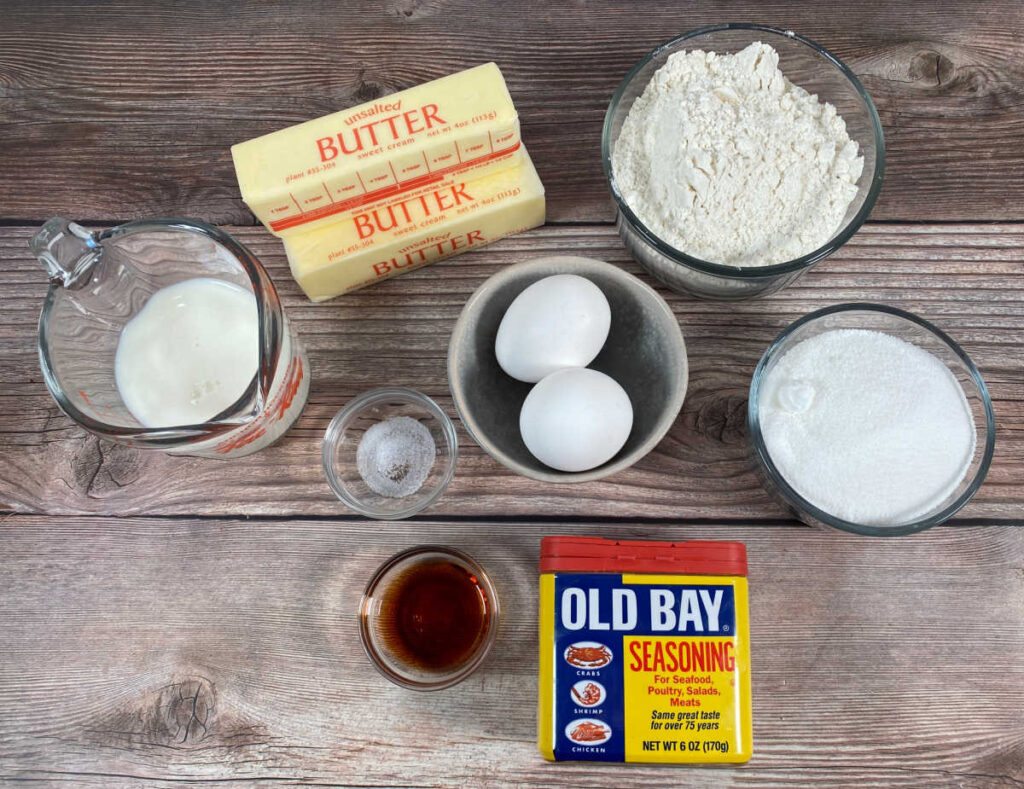 ingredients for this recipe sit in glass containers on a wooden background. 