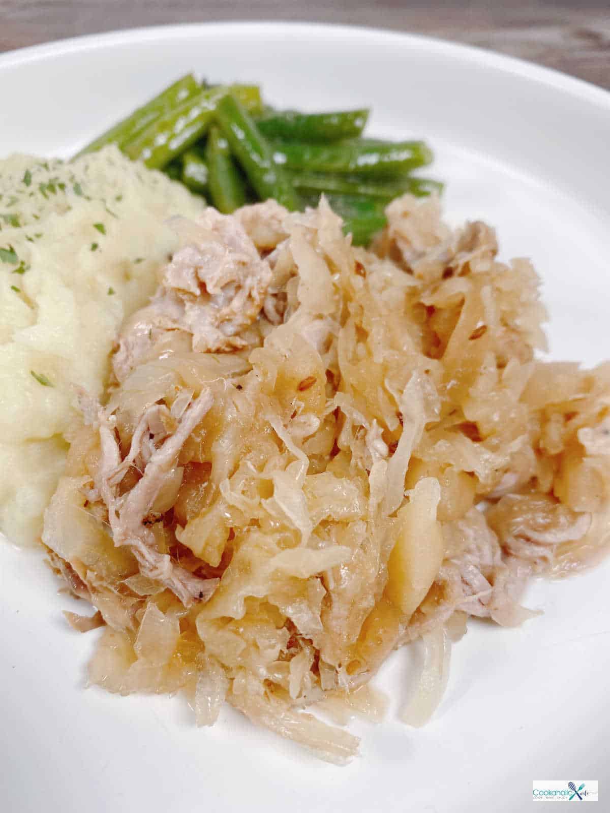 Slow Cooker Pork and Sauerkraut Cookaholic Wife