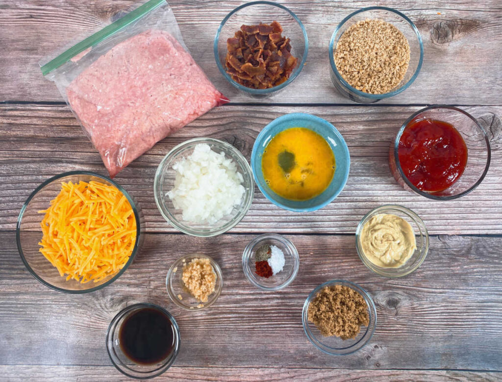 ingredients for this recipe sit in glass bowls on a wooden background. 